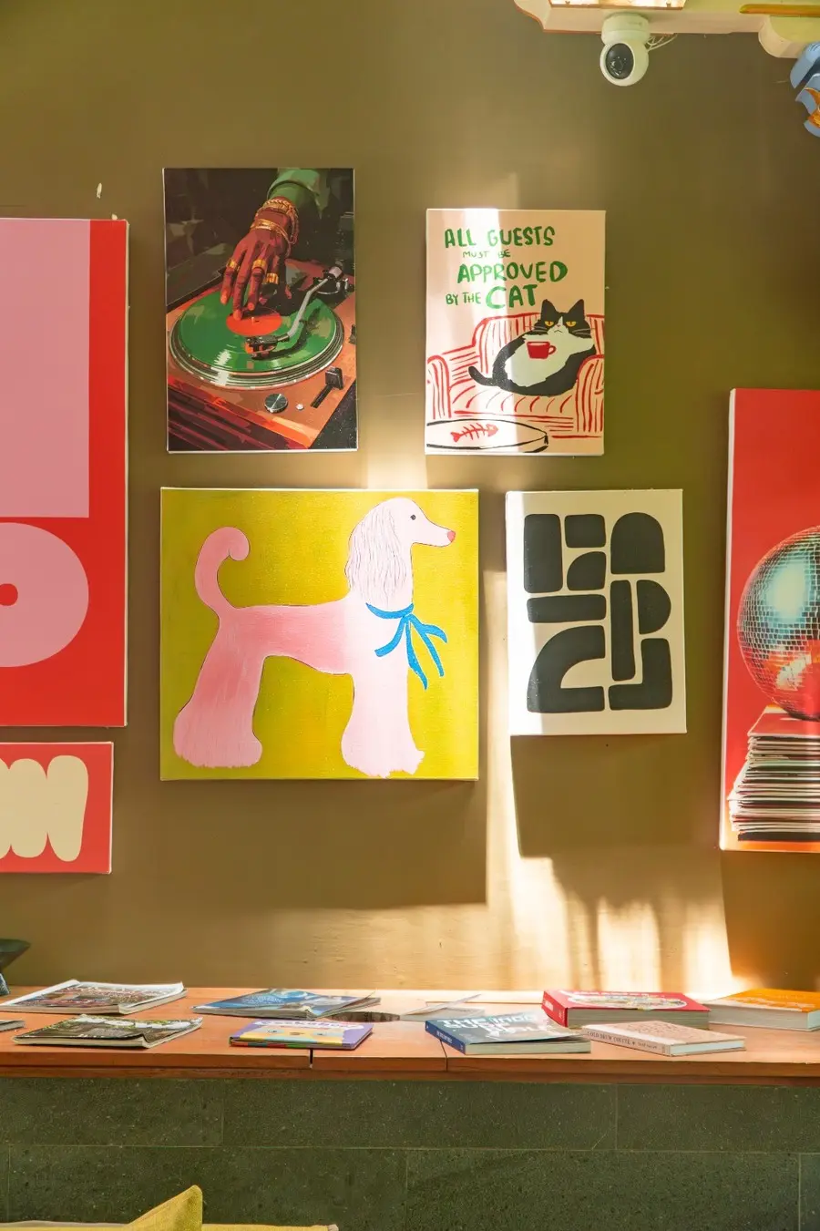 Colorful art gallery wall with abstract paintings