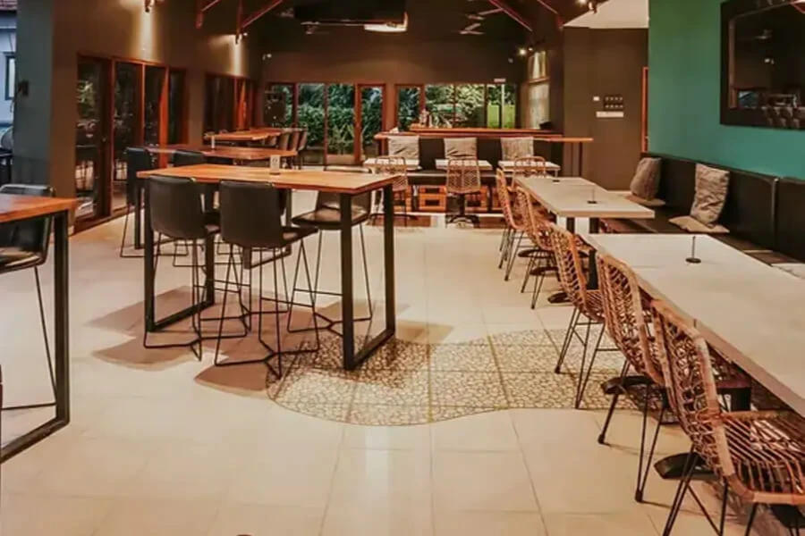 Empty restaurant interior with various tables and chairs